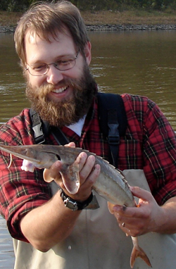 VIMS professor Eric Hilton holds a shovelnose sturgeon (Scaphirhynchus platorynchus) from the Missouri River.