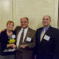 Bruce Bracken is flanked by wife Mary Jo and son Bruce, Jr., at last Friday's ceremony in Georgia.