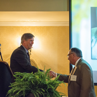 Dr. Bracken accepts congratulations from University of Georgia Dean of the College of Education, Andy M. Horne, Ph.D.