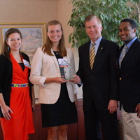 Campus Kitchen's Chelsea Estancona, Sarah Holko and Tony Batt flank Gov. McDonnell.