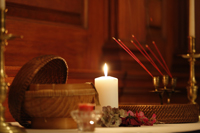 A candle lit in the Wren Chapel during one of the vigils that was held for the people affected by Typhoon Haiyan