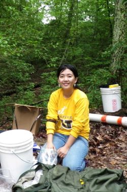 VIMS post-doctoral researcher Yuehan Lu collects field samples from the Chesapeake Bay watershed. Photo courtesy of Sarah Cammer.