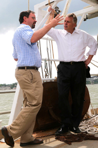 Professor Rob Latour discusses VIMS' multispecies fish surveys with Governor Terry McAuliffe aboard the RV Bay Eagle. (Photo by Michaele White)