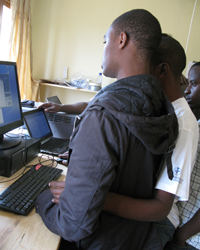 Rwandans help Potter with indoor preparations, instruments, and computer data communication at the Rwanda Climate Observatory.
