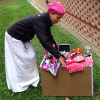 Ross sets up the altar she created as part of her project.