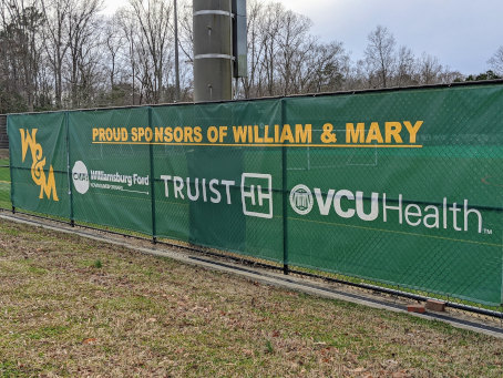 sponsorships screen on the fence of athletics field