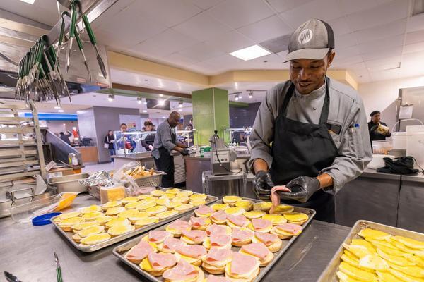 A W&M Dining employee prepares meals in Sadler Food Hall.