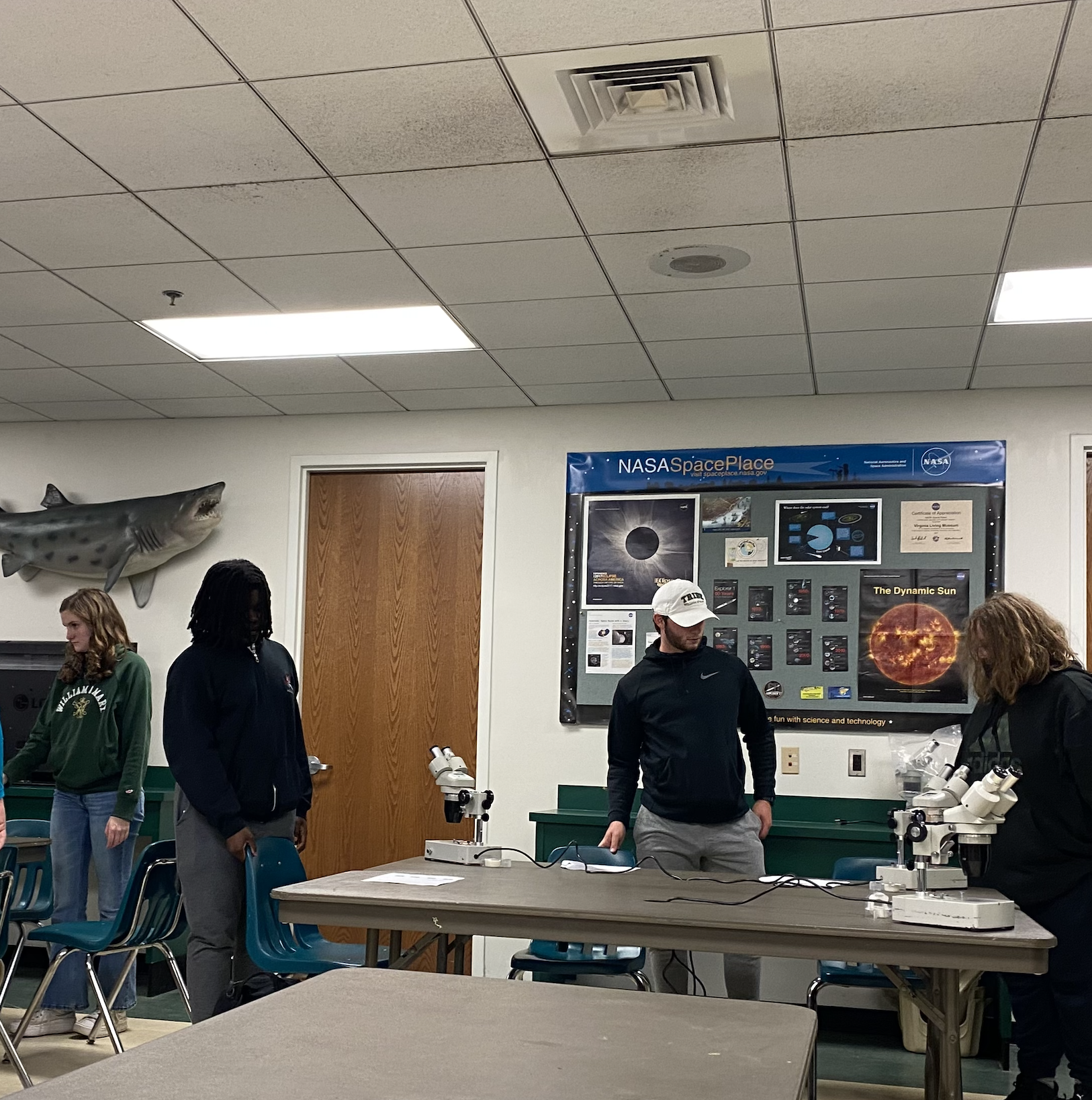 Students and GSP Volunteers participating in a plant microscope activity at the VA Living Museum