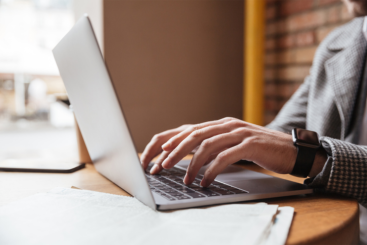 A person typing on a laptop.