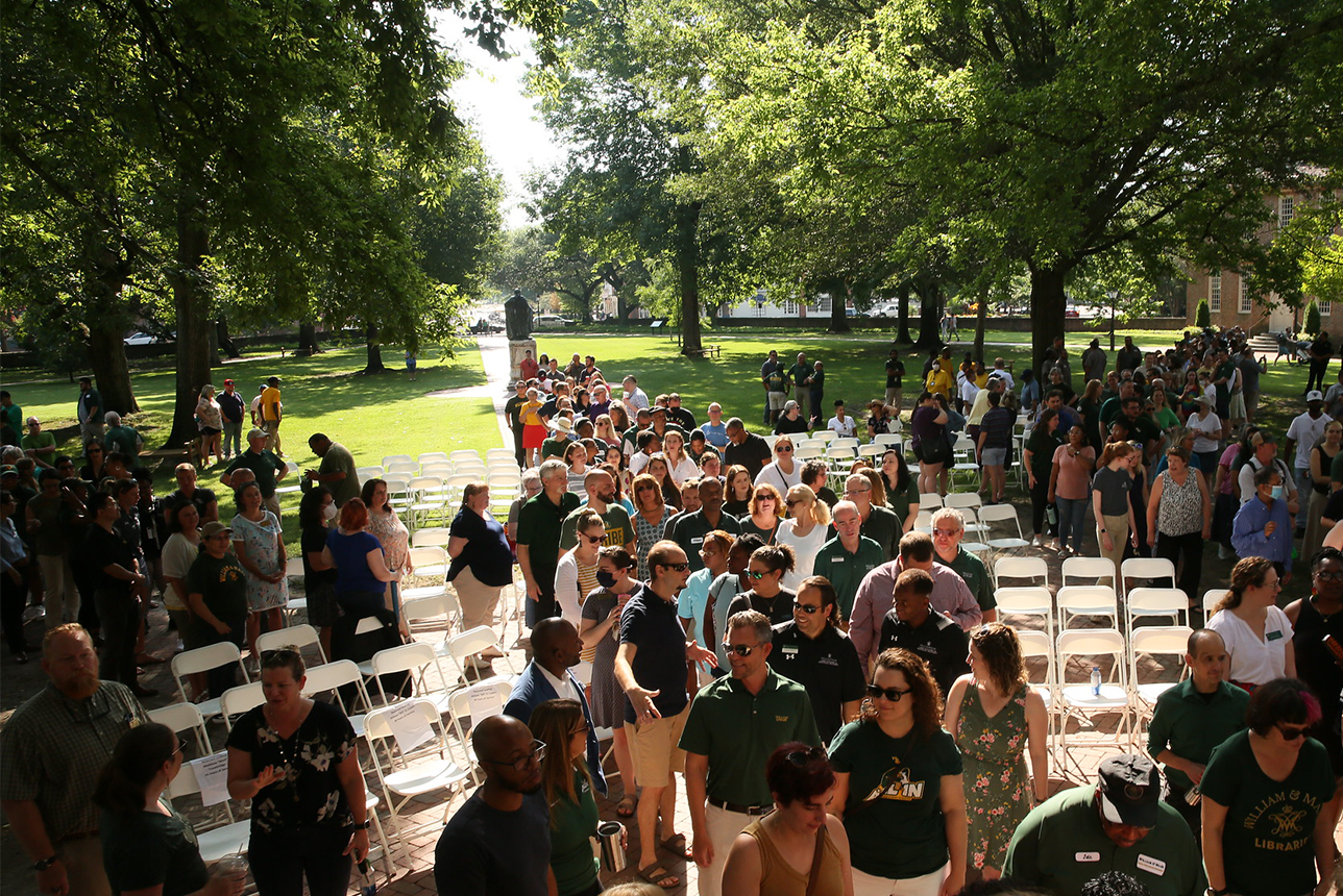 Faculty and staff of William & Mary enter the Wren Building during Employee Convocation.