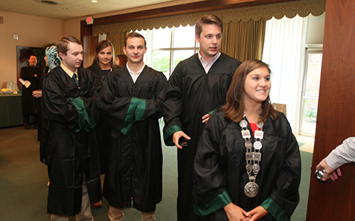 Baccalaureate graduates smile before the ceremony