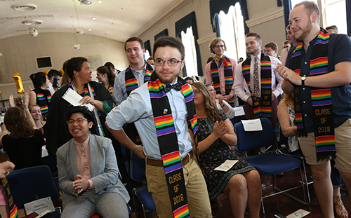 Students gather in their rainbow scarves during the lavender ceremony.