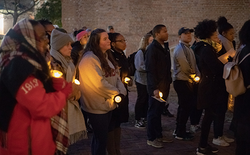 Students by candlelight on the Wren Yard for the MLK Commemoration