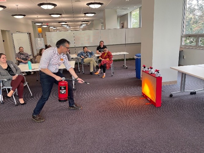 Staff putting out simulated fire