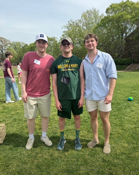Two W&M fraternity members with an Arc client at the 2025 Spring Arc Carnival.