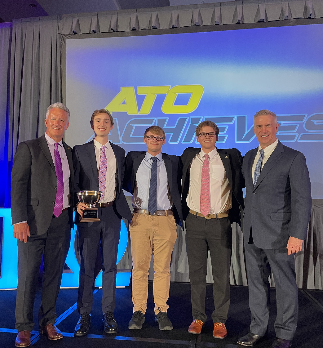 Alpha Tau Omega members accepting a national award.
