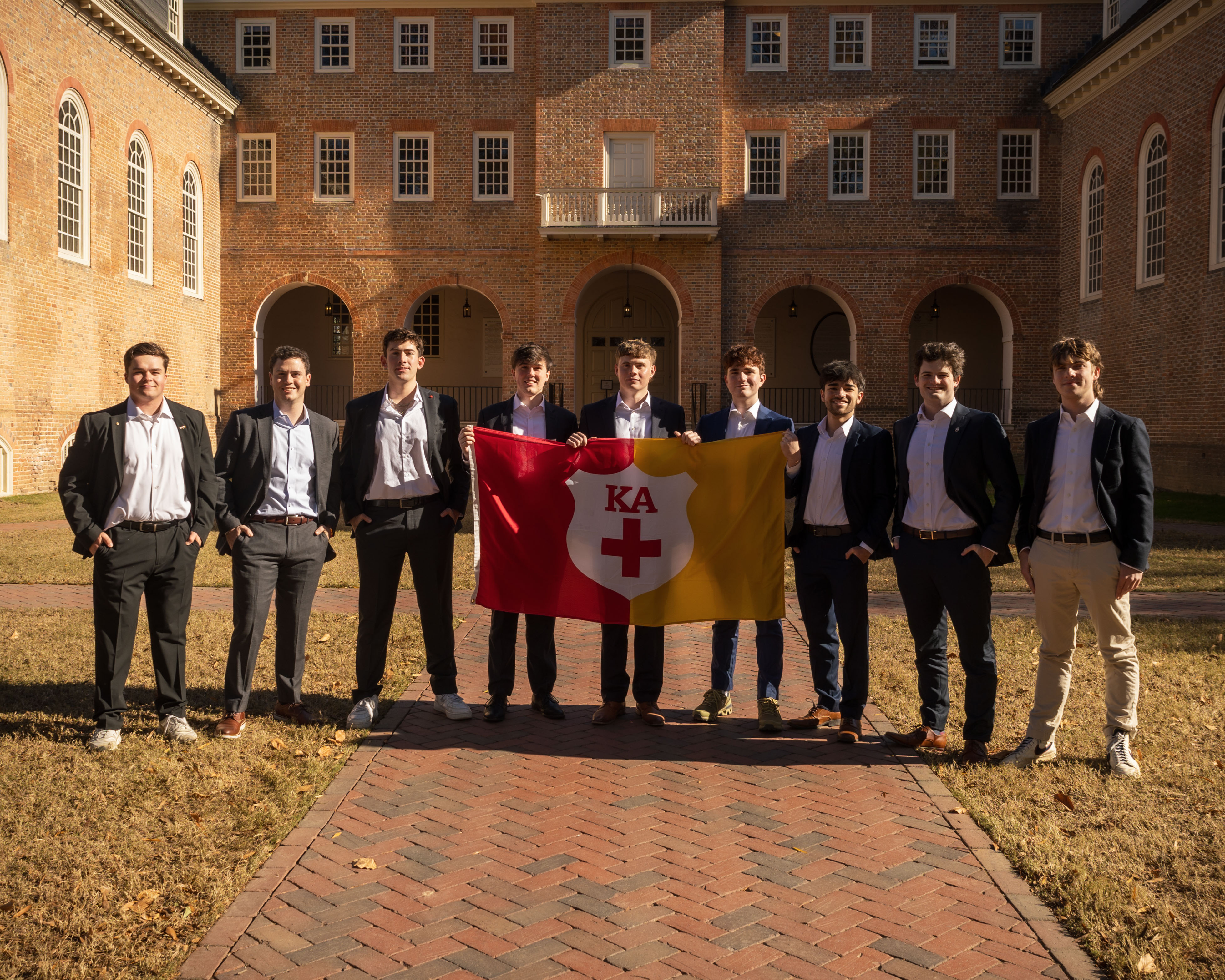 Kappa Alpha brothers pose as a group in front of the Wren building.