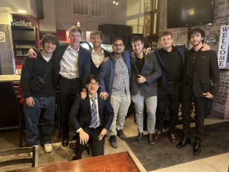 Members of Theta Delta Chi posed for a photo.