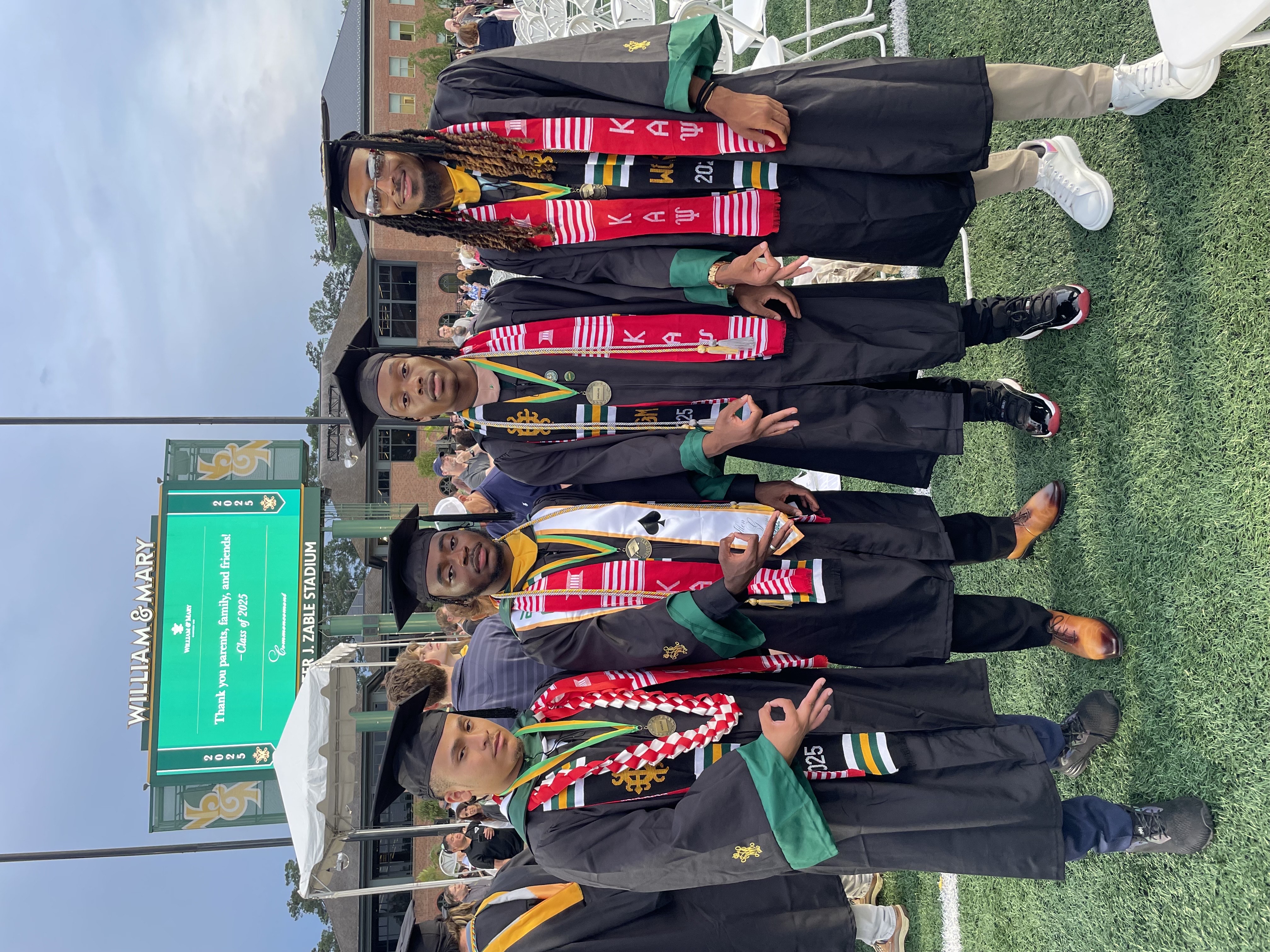 Kappa Alpha Psi brothers pose for graduation.