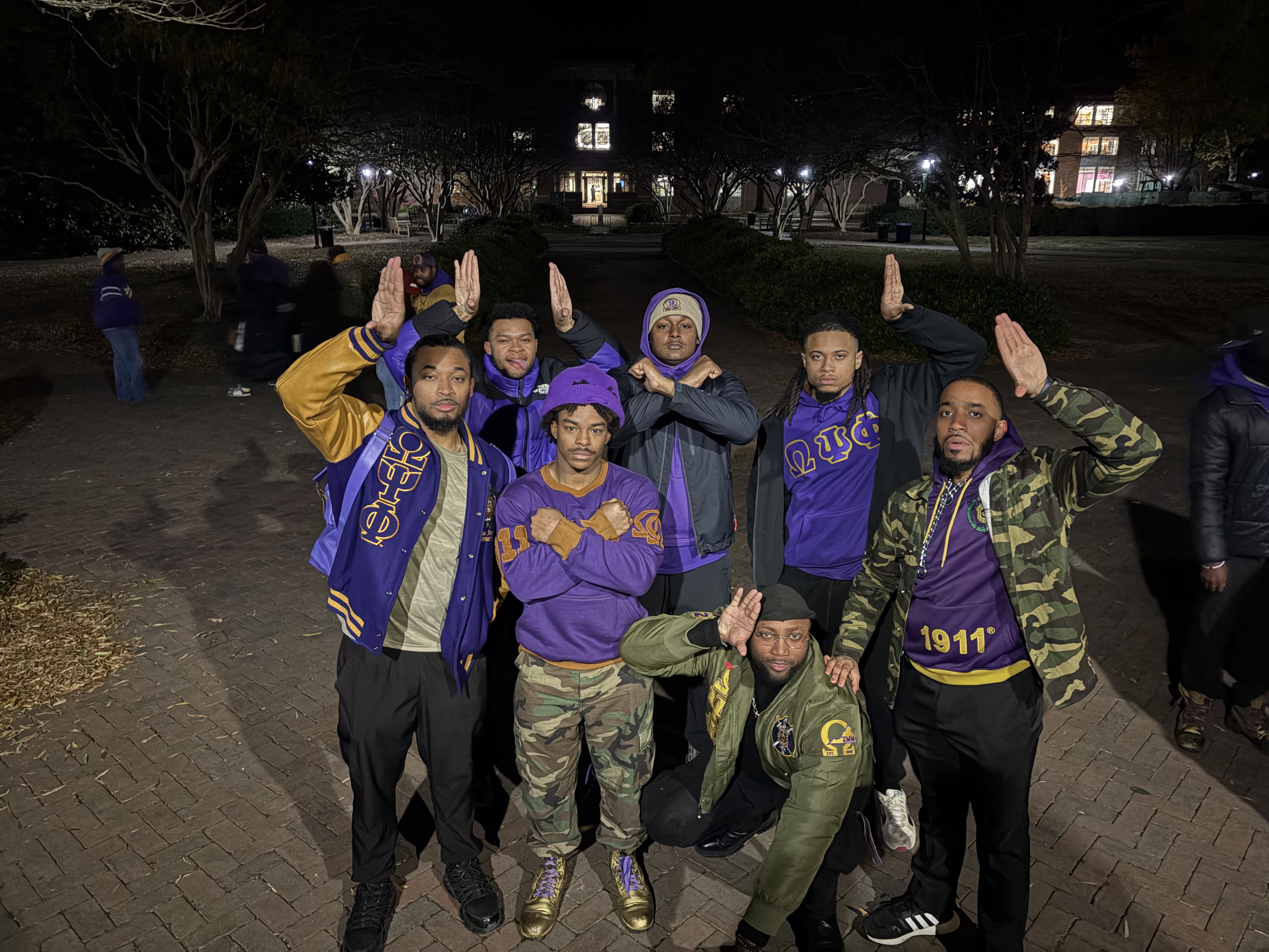 Omega Psi Phi brothers pose together.
