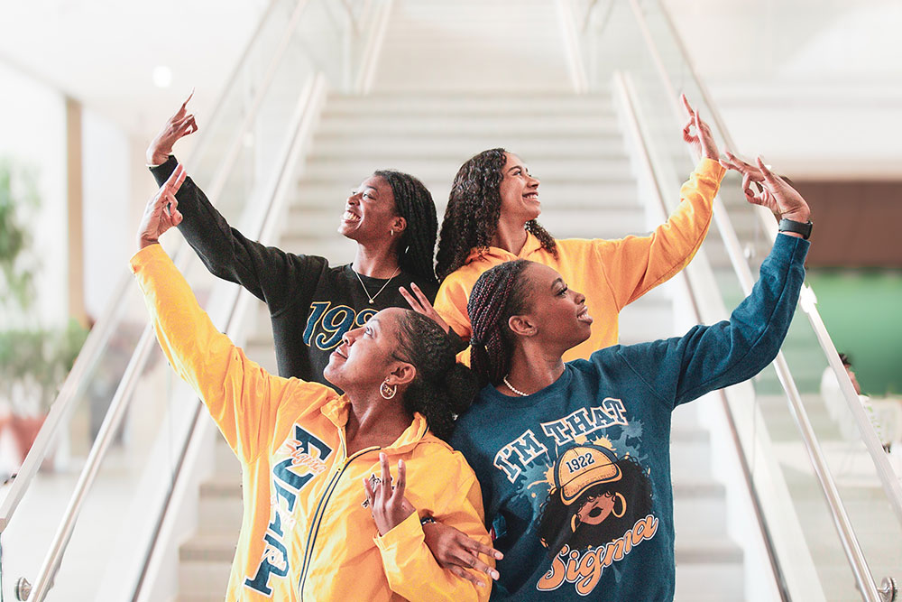 Sigma Gamma Rho members pose as a group.