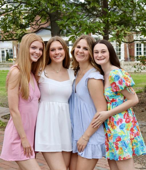 Four Panhellenic members posed smiling