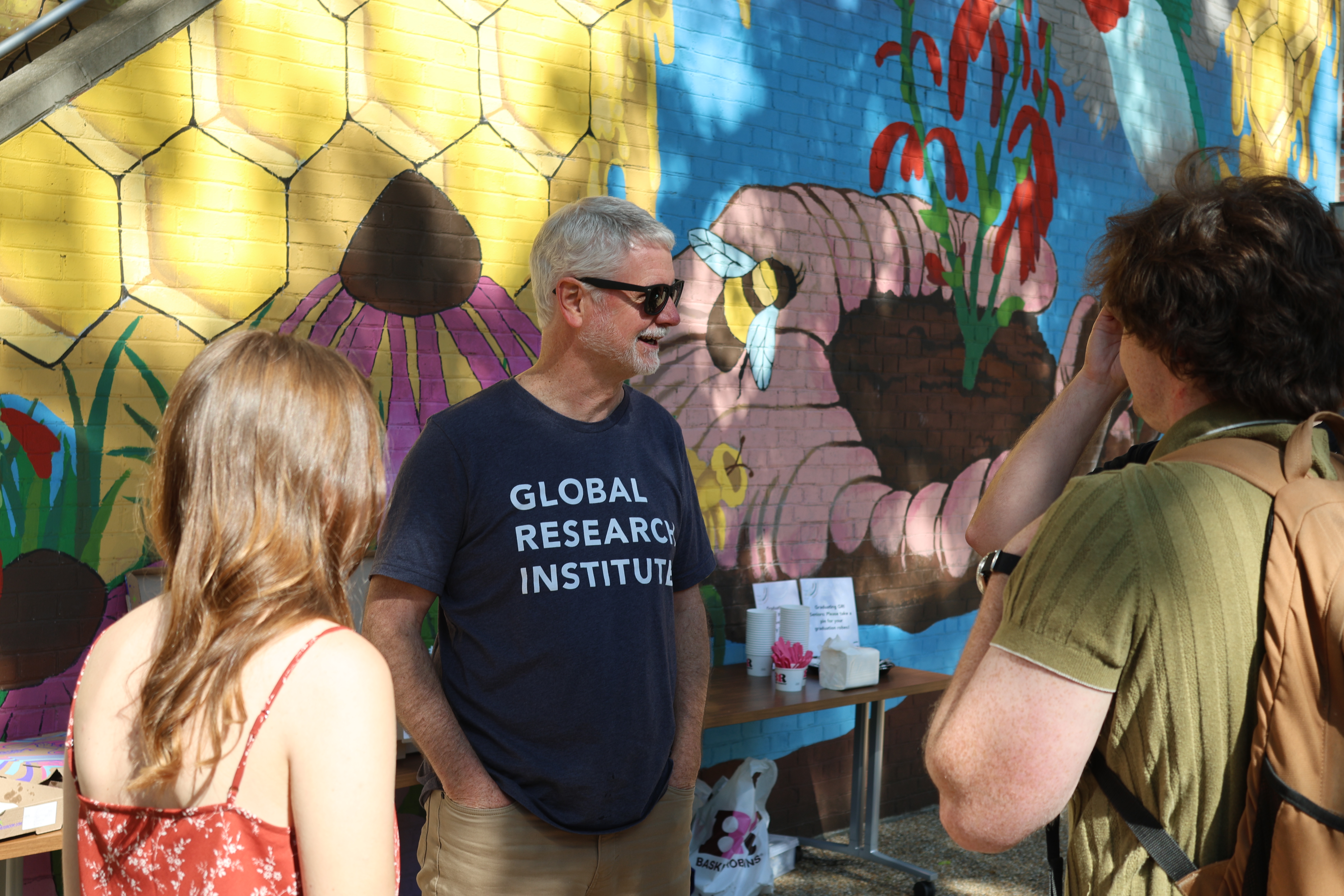 Director Mike Tierney Talks with students at bbq.