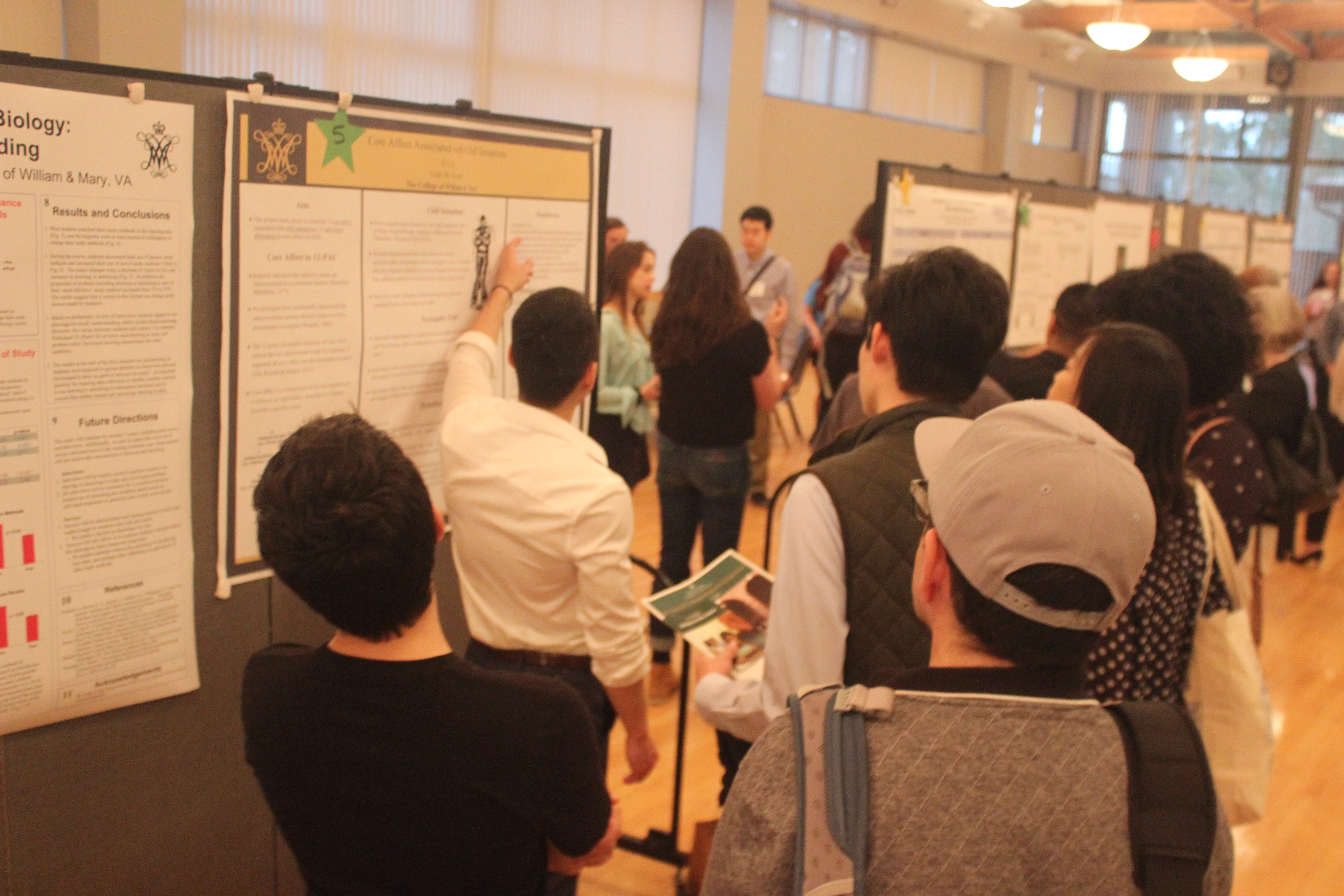 GRS presenter explaining his poster to attendees