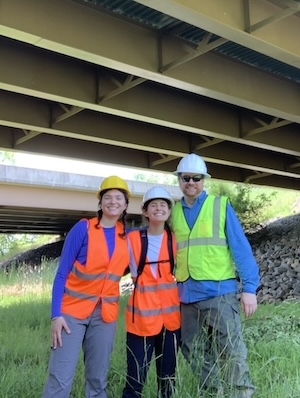 Sofia Politte '26 and Cayley Santella '25 with Virginia DWR partner Jordan Green at an underpass field site after setting up the cameras in Loudoun County, VA. PHOTO: Courtesy of Sofia Politte