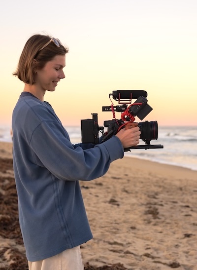 Virginia Dare Johnson '25 scans the beach with her camera. PHOTO: Courtesy of Virginia Dare Johnson
