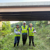 Students and Conservation partner under overpass