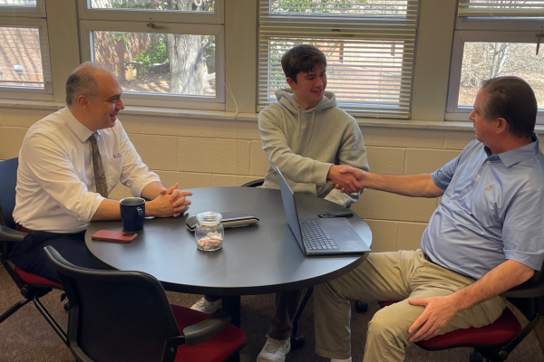 IT Intern Jack Hayes meets with CIO Ed Aractingi and CISO Pete Kellogg