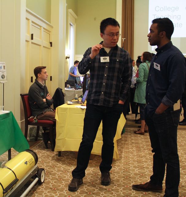 IT intern Mike Walker talking with Donglai Gong from VIMS about the underwater glider he uses for his research. 