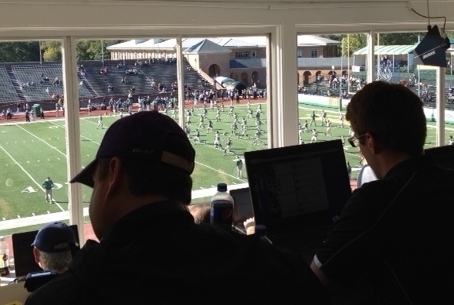 In the press box, the visiting team coaches connect their laptops to the W&M network prior to the start of the game.