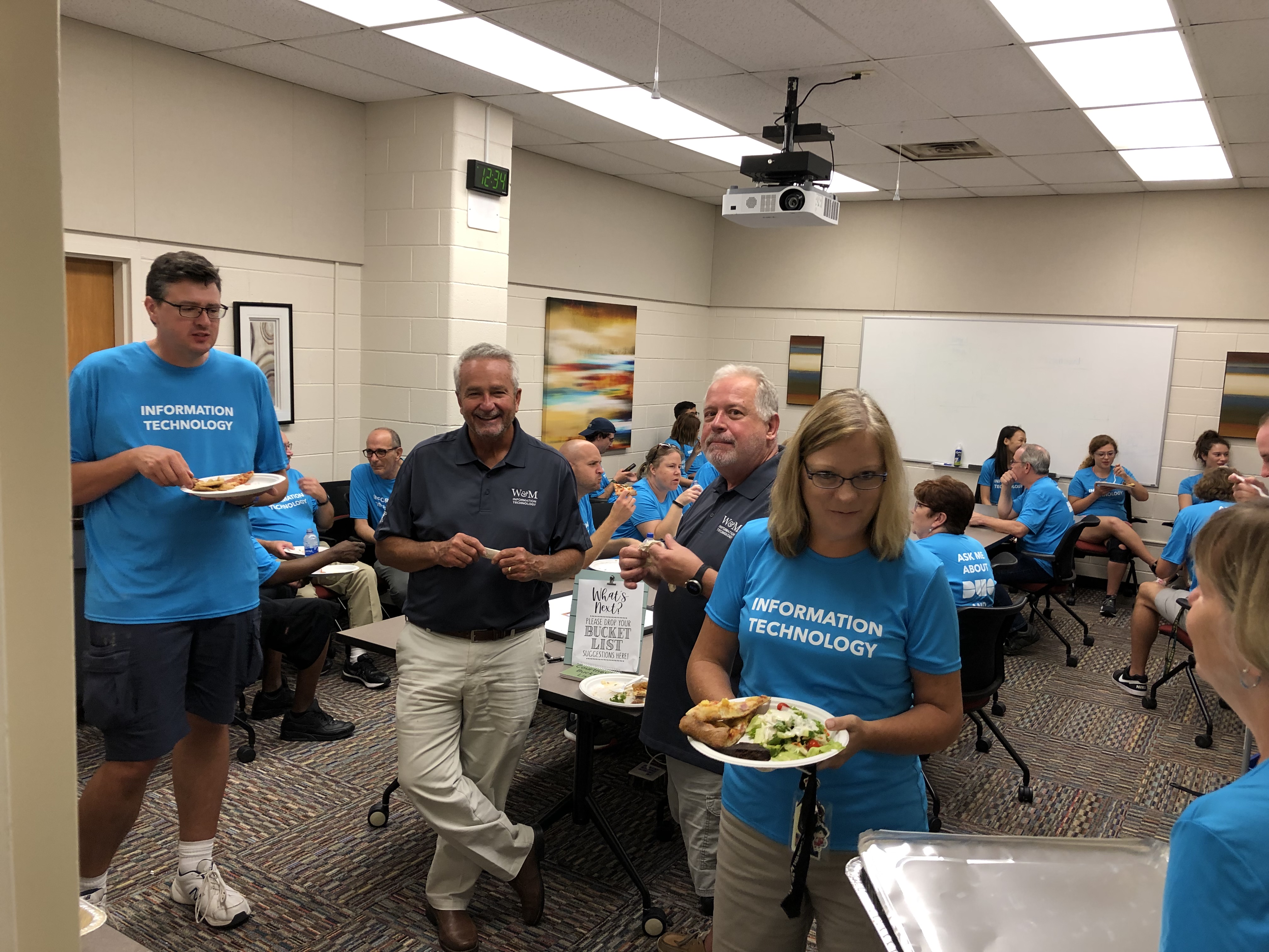 IT workers enjoy lunch after assisting students during Move-In