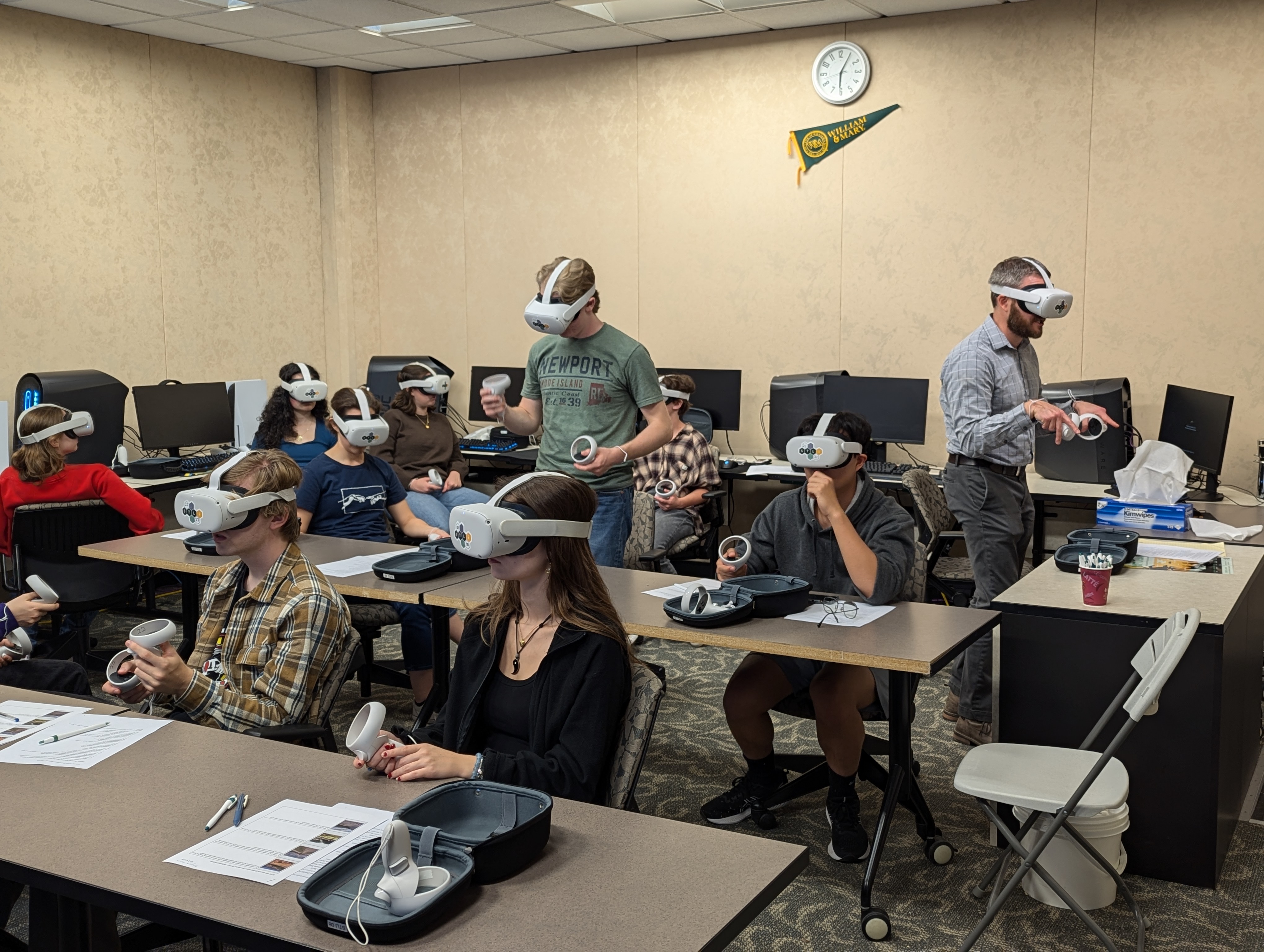 Enthusiastic students interacting with VR headsets in the classroom