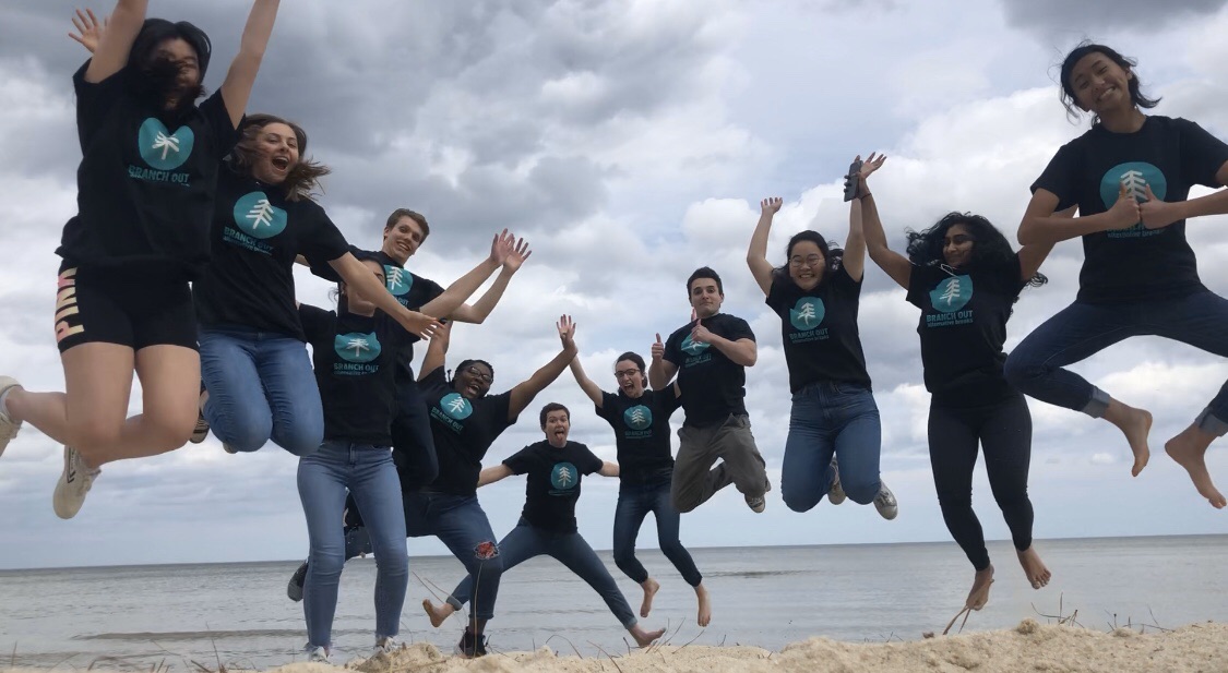 Branch Out team at Northern Neck Free Clinic jumping on beach