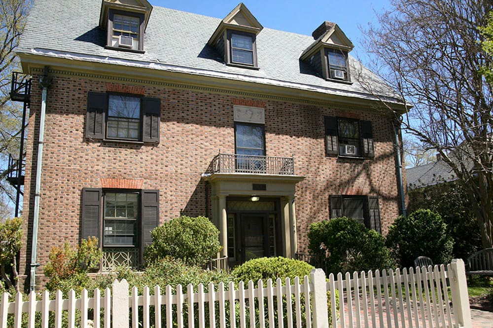 An historic brick house with dormer windows