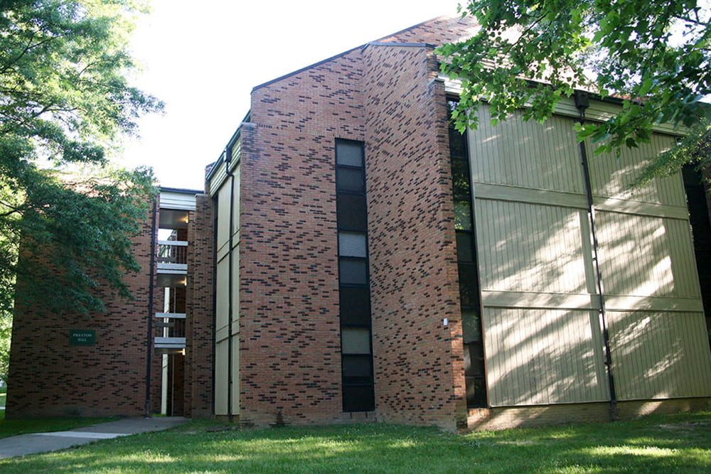 A three story brick building with exposed breezeways