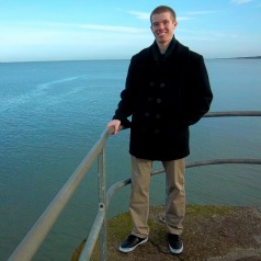Marshall Zobel on the pier of St Andrews with the North Sea in the background.