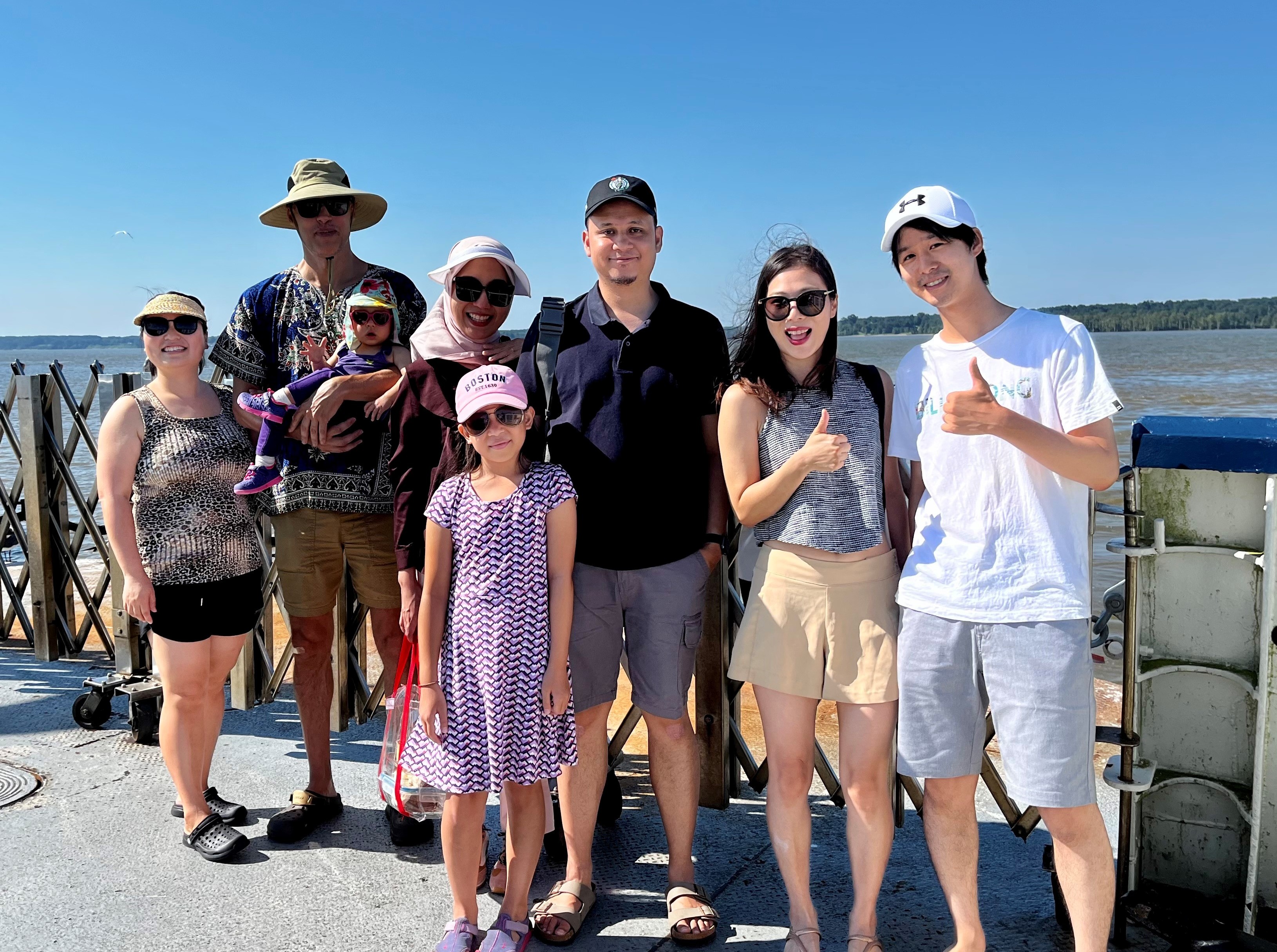 smiling people, group, outdoors, water, adults and children