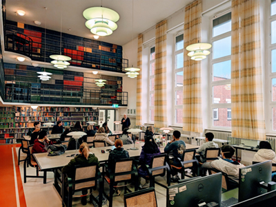 The group, situated in the central library, enjoys a seminar on social and historical developments in science from Prof. Herbert Zimmermann at the Max Planck Institute for Medical Research. Courtesy Tyler Meldrum