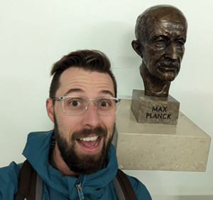 Prof. Meldrum with an icon of 20th century physical chemistry: Max Planck. Courtesy Tyler Meldrum