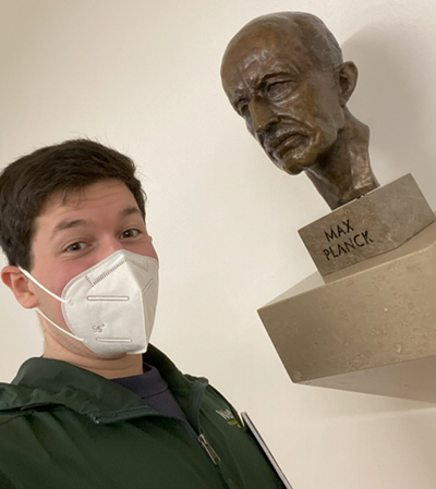 Rubin with bust of Max Planck. Courtesy Sam Rubin