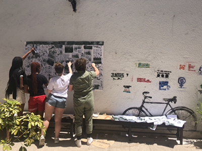 Students stenciling a wall at CPM's Museo de arte & memoria (Photo credit: Silvia Tandeciarz)