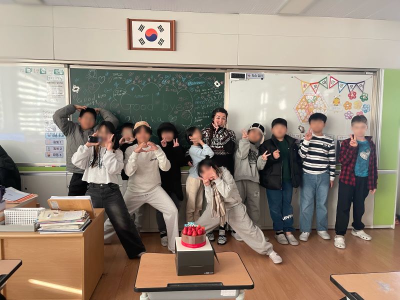 Mika with some of her students. Their faces are obscured to protect their privacy. (Courtesy photo)