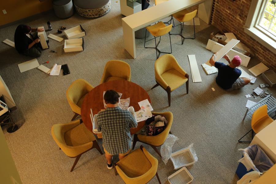 Everyone pitches in putting together those new furniture purchases.