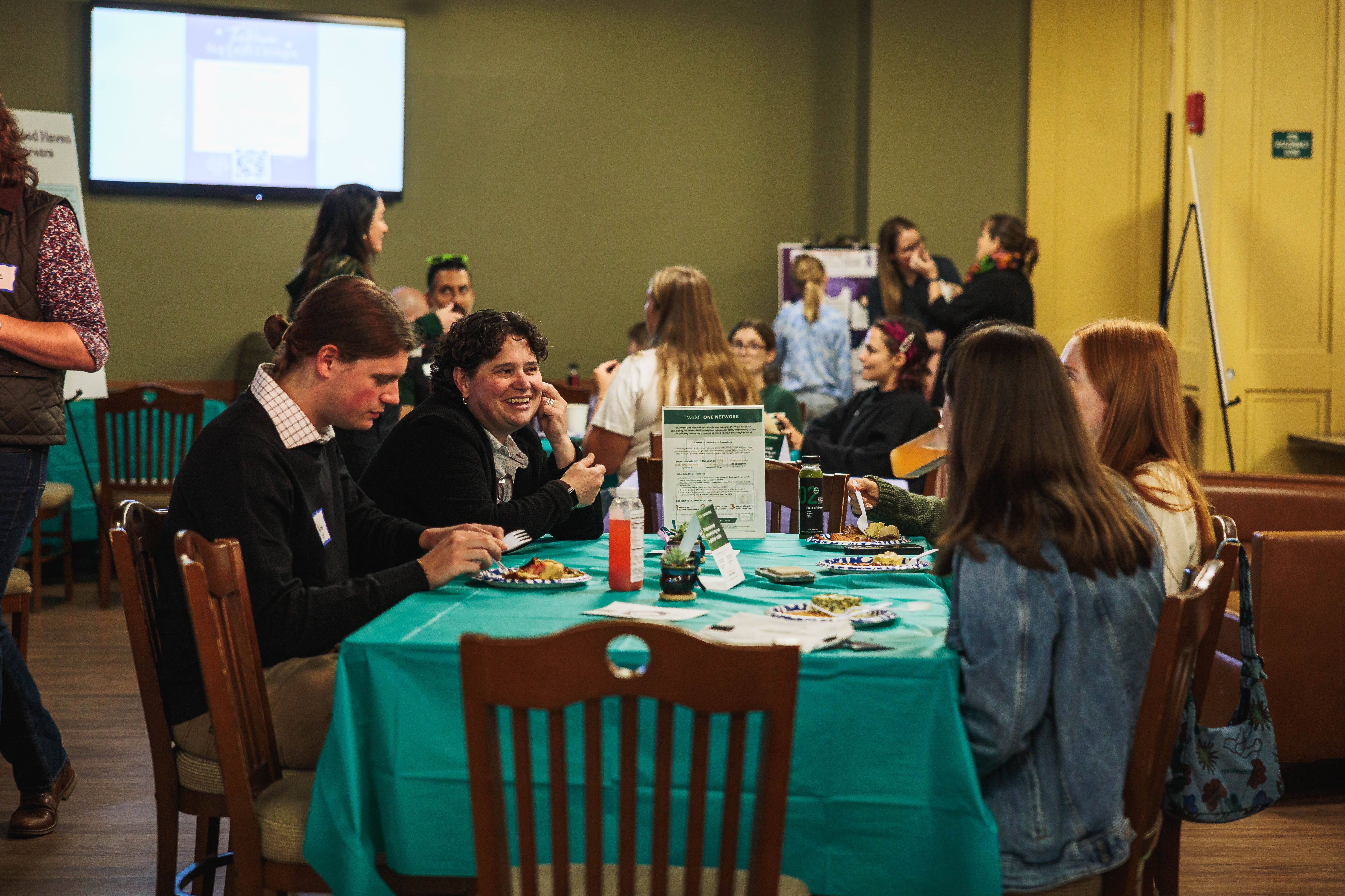 Liz Cascone, inaugural director of The Haven, discusses the program with past and present peer advocates over brunch. (Photo by Nate Boyle '27)