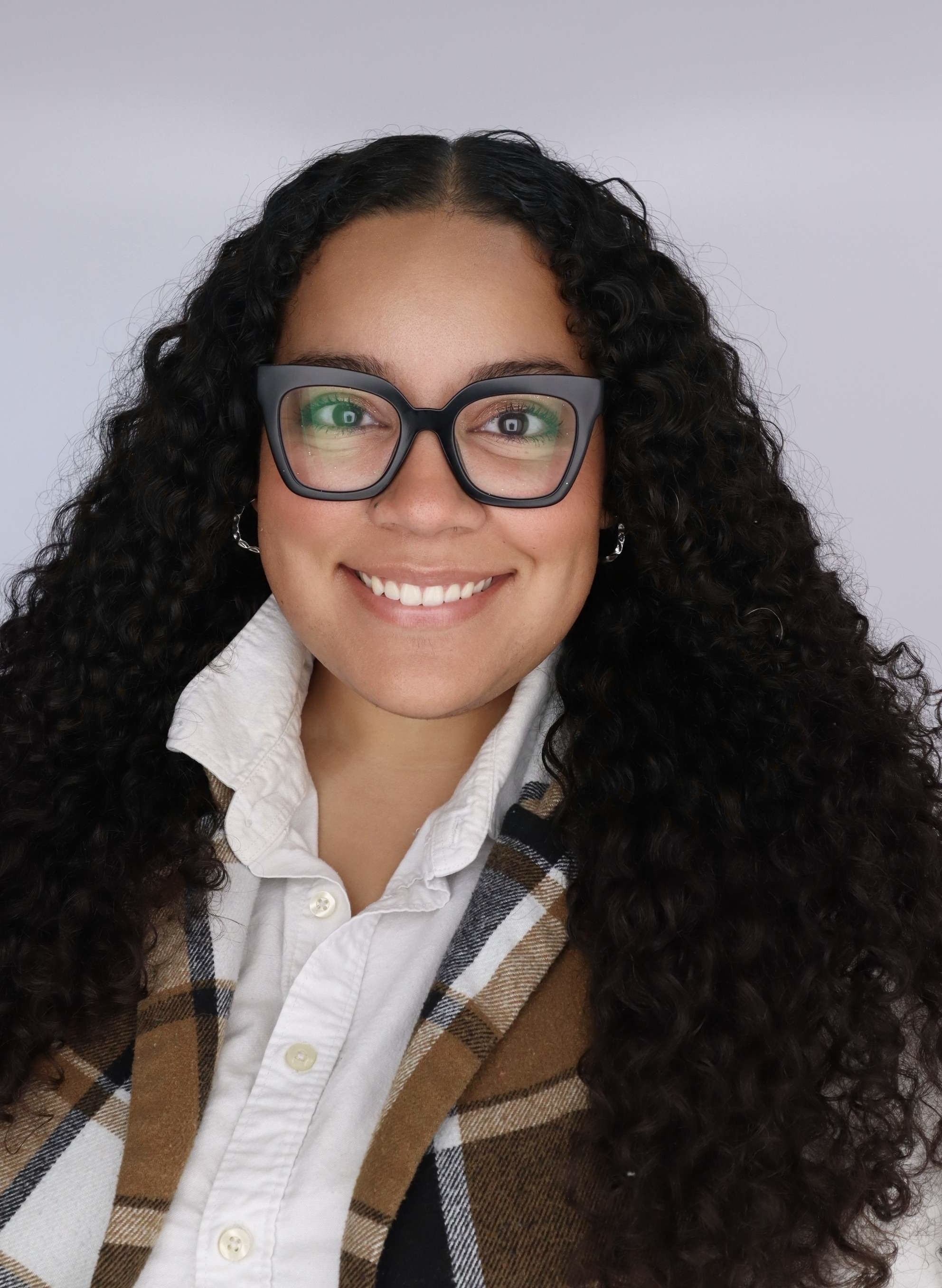 Kristina James smiles at the camera.