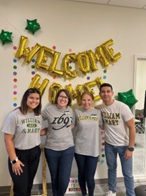 Staff in Care Support Services, including Jenny Call '99, welcome students to William & Mary during the annual Student Life Neighborhood Block Party.